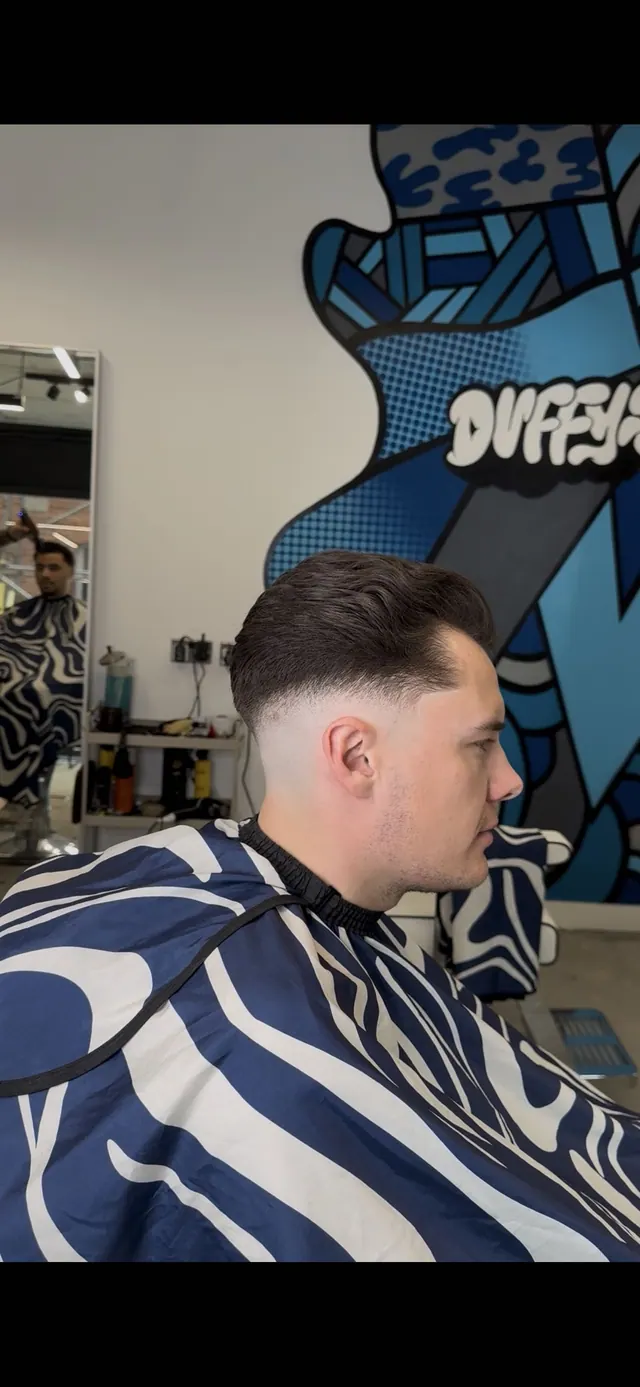 A swept-back cut with a skin fade