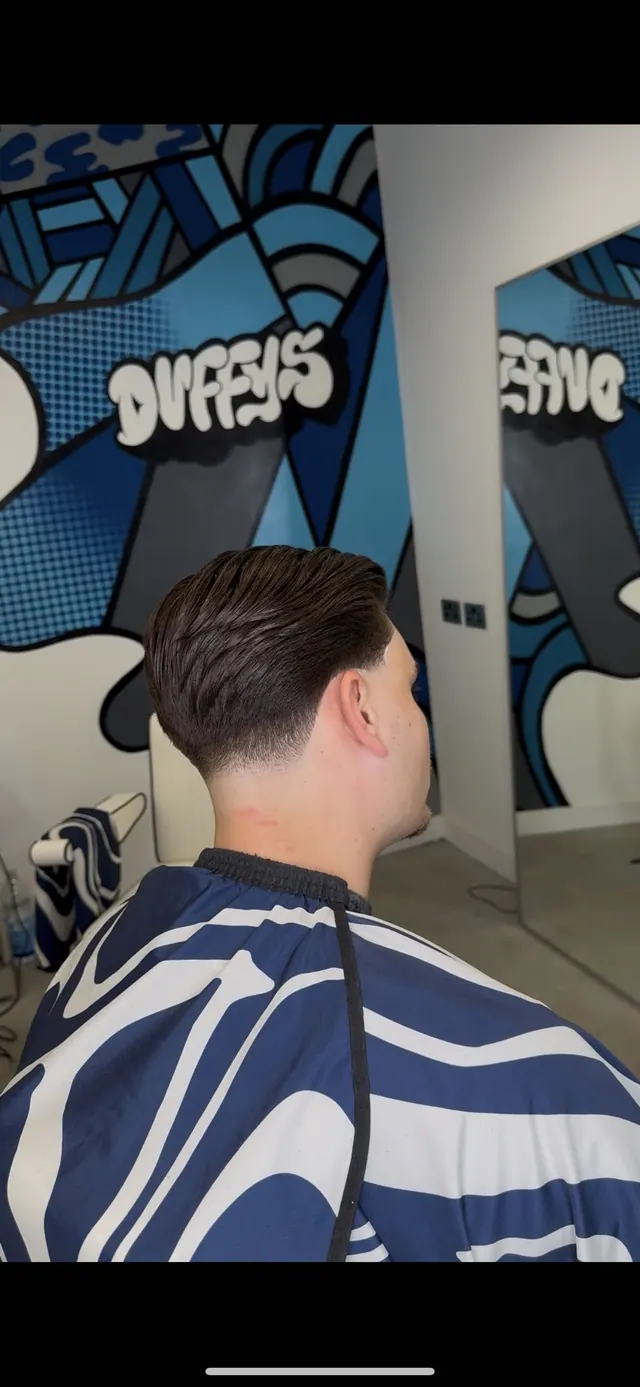 A swept-back cut with a taper, from behind