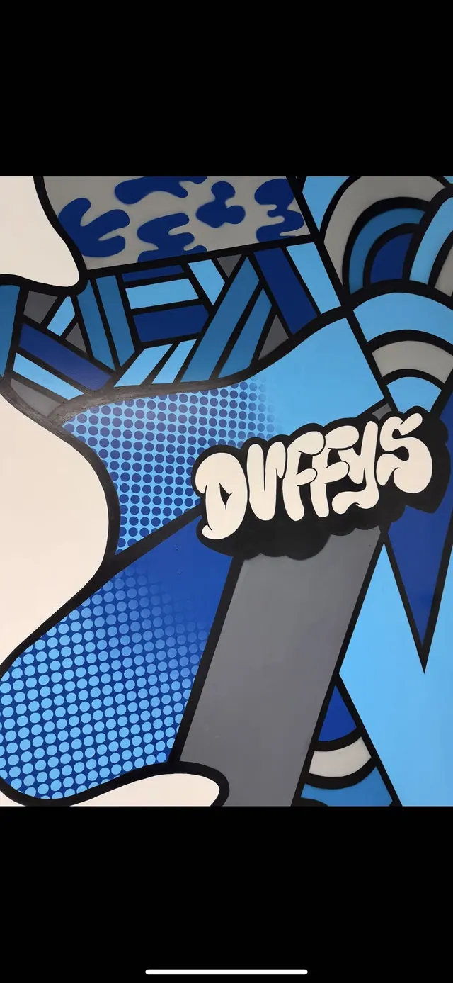 The mural on the shop wall